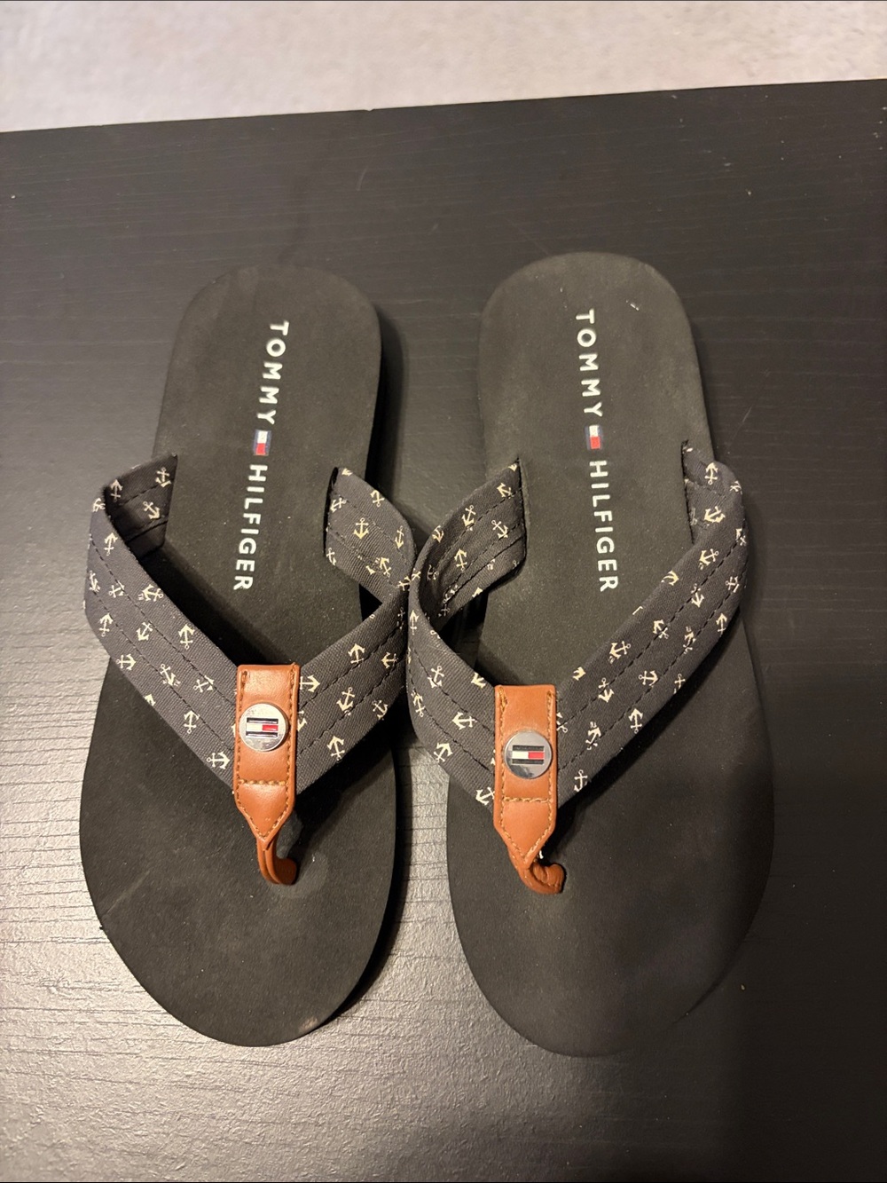 Tommy Hilfiger Black Flip Flops with Brown Leather Trim and Anchor Print